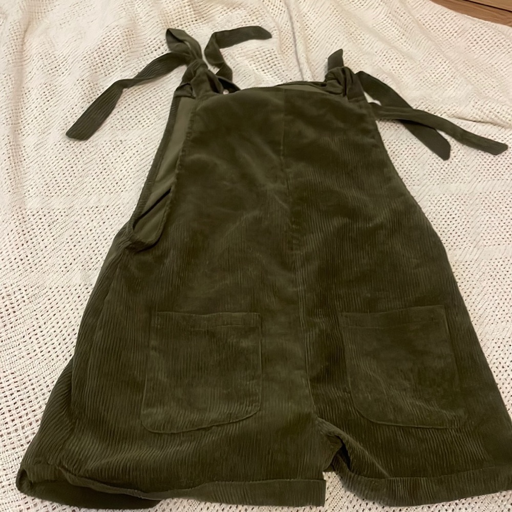 Green romper ties at the shoulders
